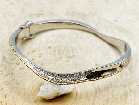 Sterling silver and 18 karat yellow gold diamond bangle bracelet. $1100.00