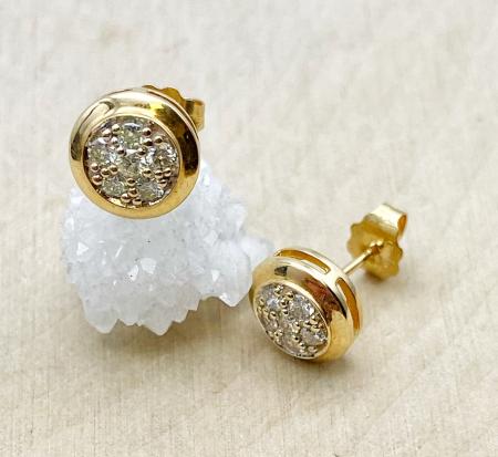 14 karat yellow gold diamond cluster stud earrings. $1150.00