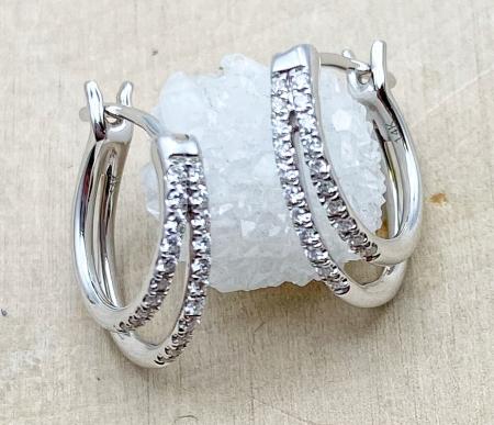 14 karat white gold diamond hoop earrings. $1050.00