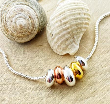 Sterling silver tri-color pebble necklace. $190.00