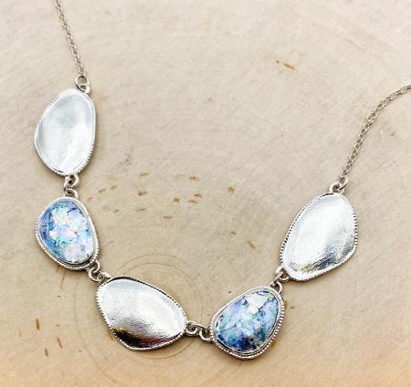 Sterling silver Roman glass necklace with textured oval discs. $495.00