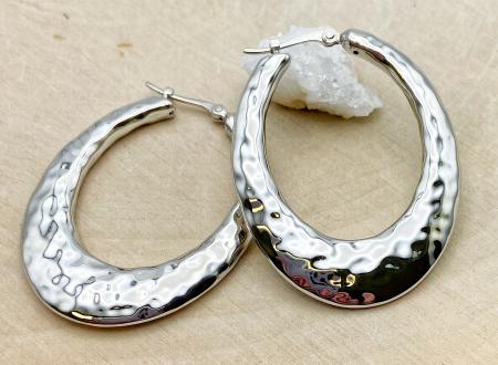 Sterling silver hammered hoop earrings. $115.00