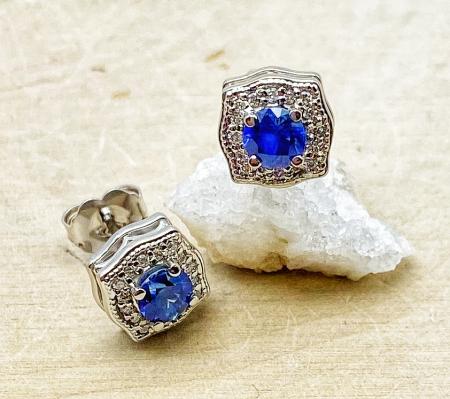 14 Karat white gold blue sapphire and diamond stud earrings. $1650.0