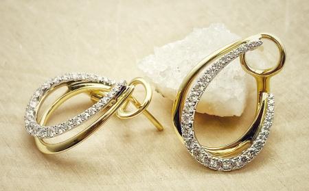 14 karat yellow and white gold diamond "j" design hoops. $2975.00