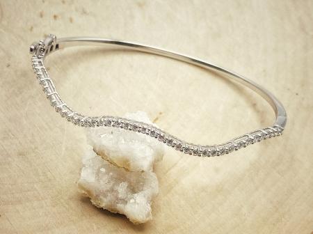 14 karat white gold lab grown diamond curve bangle bracelet. $2060.00