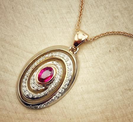 18 karat white and rose gold, ruby and diamond necklace. $5,600.00