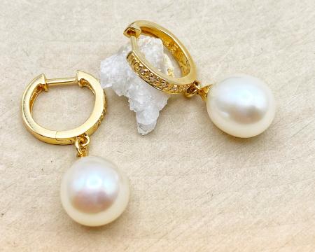 14 karat yellow gold 9mm freshwater cultured pearl and diamond earrings. $685.00