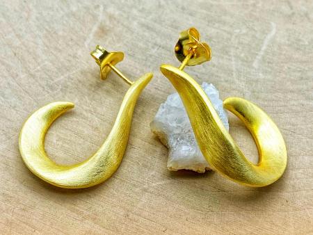 Sterling silver and 18 karat yellow gold vermeil "J" hoops. $185.00