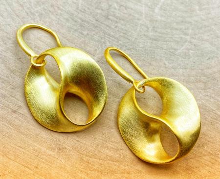 Sterling silver and 18 karat yellow gold vermeil "love swirl" earrings. $285.00