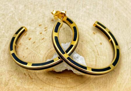Sterling silver and 14 karat yellow gold vermeil black resin hoop earrings. $450.00