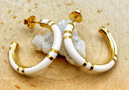 Sterling silver and 14 karat yellow gold vermeil white resin hoops. $255.00