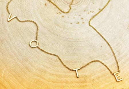 14 karat yellow gold VOTE station necklace. $450.00