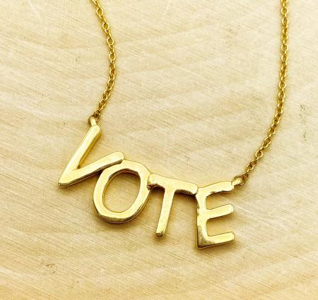 14 karat yellow gold VOTE necklace. $495.00