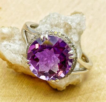 14 karat white gold checkerboard cut amethyst and diamond ring. $980.00