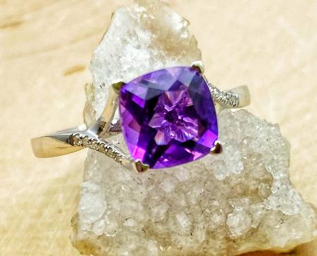 14 karat white gold cushion cut amethyst and diamond ring. $725.00