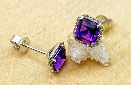14 karat white gold step cut amethyst and diamond earrings. $750.00