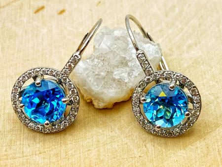14 karat white gold Swiss blue topaz and diamond lever back earrings. 1475.00