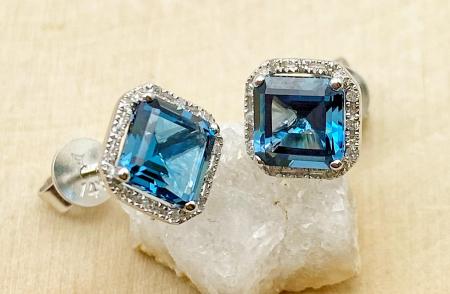 14 karat white gold London blue step cut blue topaz and diamond earrings. $750.00