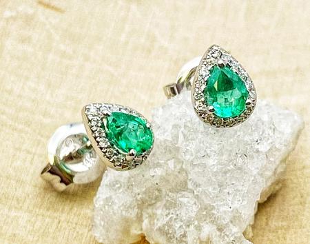14 karat white gold pear shape faceted emerald and diamond earrings. $735.00