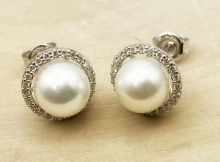14 karat white gold Akoya cultured pearl and diamond halo earrings. $1750.00