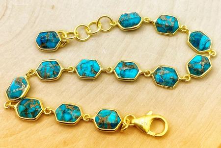 Sterling silver and 18 karat gold vermeil fancy cut turquoise bracelet. $420.00