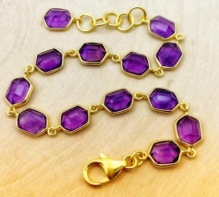 Sterling silver and 18 karat gold vermeil fancy cut amethyst bracelet. $420.00