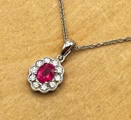 14 karat white gold ruby and diamond necklace. $2580.00