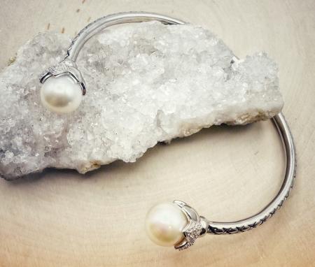 Sterling silver freshwater cultured pearl and diamond cuff bracelet. $400.00