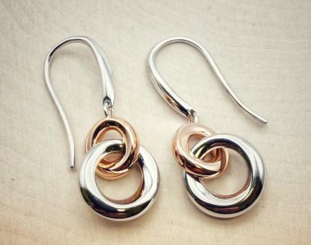Sterling silver and 18 karat rose gold vermeil double circle dangle earrings. $170.00