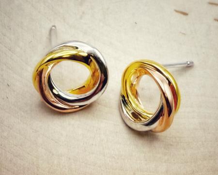 Sterling silver and 18 karat tricolor gold vermeil circle earrings. $135.00