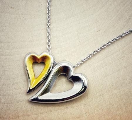 Sterling silver and 18 karat yellow gold vermeil double heart necklace. $220.00