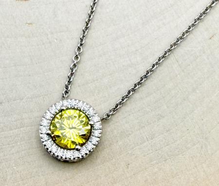 14 karat white gold enhanced intense yellow earth mined diamond halo necklace. $4,345.00