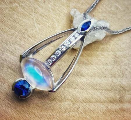 18 karat white gold 3.34 carat marquise moonstone, blue sapphire and diamond necklace. 460-11079