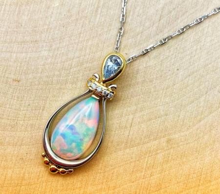 18 karat white and yellow gold 2.07 carat Ethiopian opal and diamond necklace. 550-13791