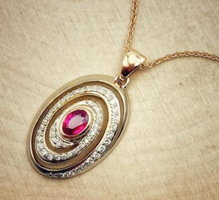 18 karat white and rose gold, 1.02 carat oval faceted ruby and diamond necklace. 550-13736
