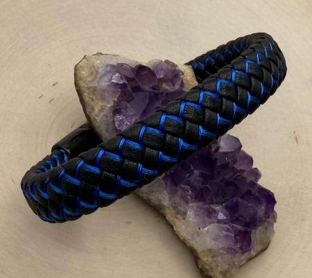 Black and blue braided leather bracelet. $60.00