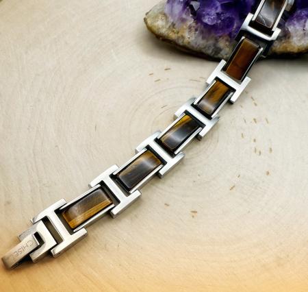 Stainless steel and tiger eye bracelet. $220.00