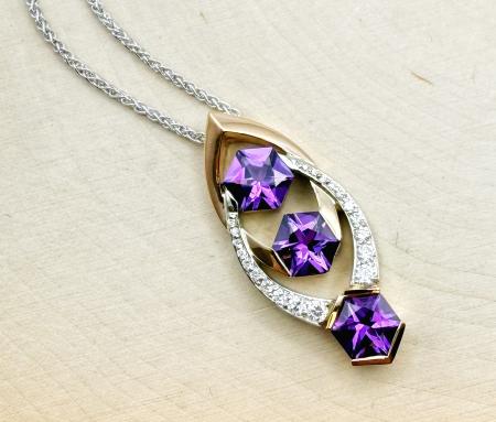 18 karat rose and white gold hexagon cut amethyst and diamond necklace. $3250.00