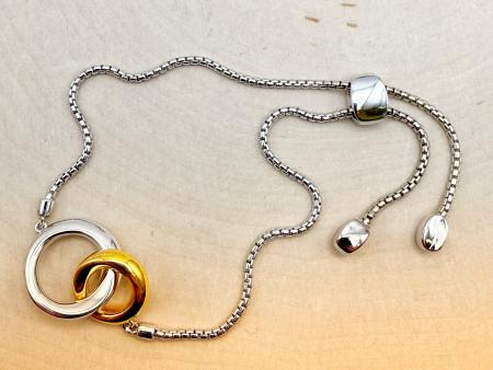 Sterling silver and 18 karat gold vermeil double circle adjustable bracelet. $185.00