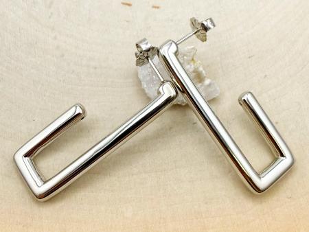 Sterling silver "J" hoops. $105.00