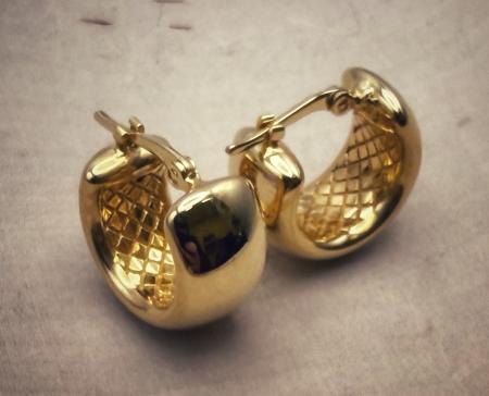 Sterling silver 22 karat yellow gold vermeil 7mm wide hoops. $162.00