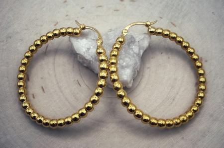 Sterling silver 22 karat yellow gold vermeil bead style hoops. $170.00