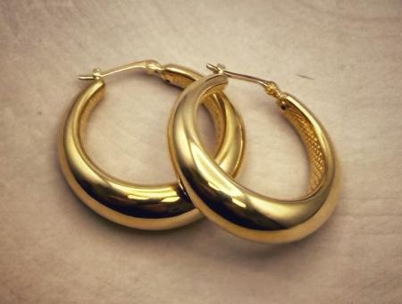 Sterling silver 22 karat yellow gold vermeil tapered hoops. $170.00
