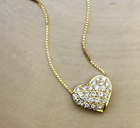 18 karat yellow gold floating diamond heart necklace. 26 brilliant cut earth mined diamonds totaling 0.75 carat. $3,000.00