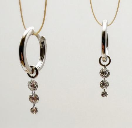 14 karat white gold "floating" diamond earrings. Six lab diamonds totaling 0.57 carat. $1500.00