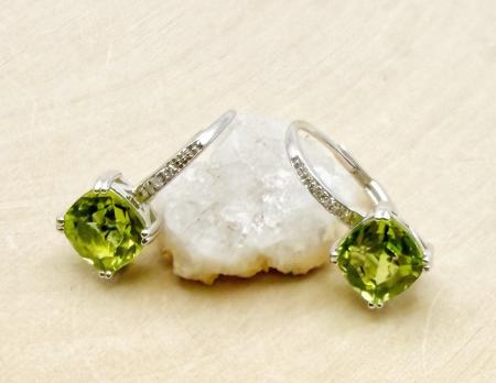 14 karat white gold cushion cut peridot and diamond earrings. $650.00