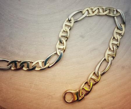 14 karat yellow and white gold solid anchor link style gentlemen's bracelet. 8.5" long x 7mm wide. $2995.00