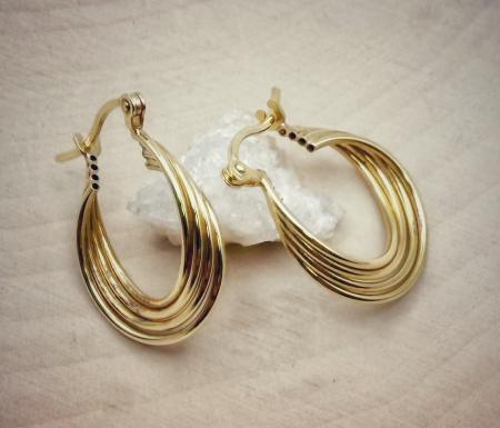 14 karat yellow gold 4 row twist hoop earrings, 15mm diameter. $285.00