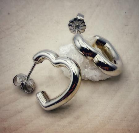 Sterling silver hear hoop earrings. $80.00