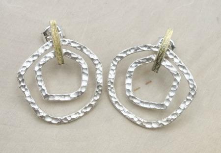 Sterling silver and 18 karat gold vermeil hammered circles earrings. $519.00